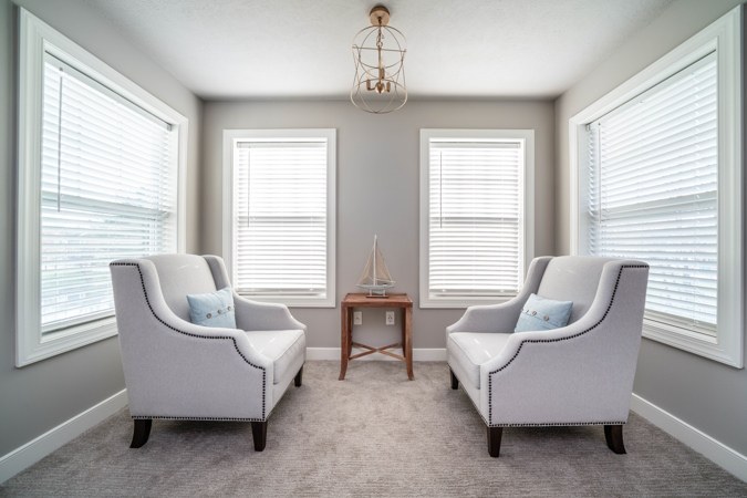 Sitting nook with two armchairs in the primary bedroom