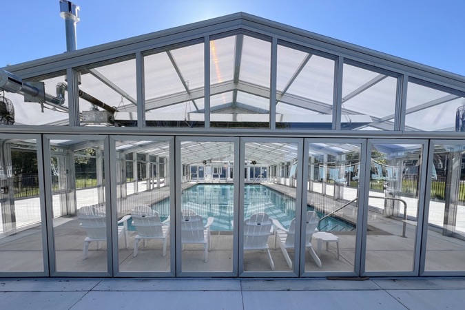 Community indoor/outdoor pool with glass walls