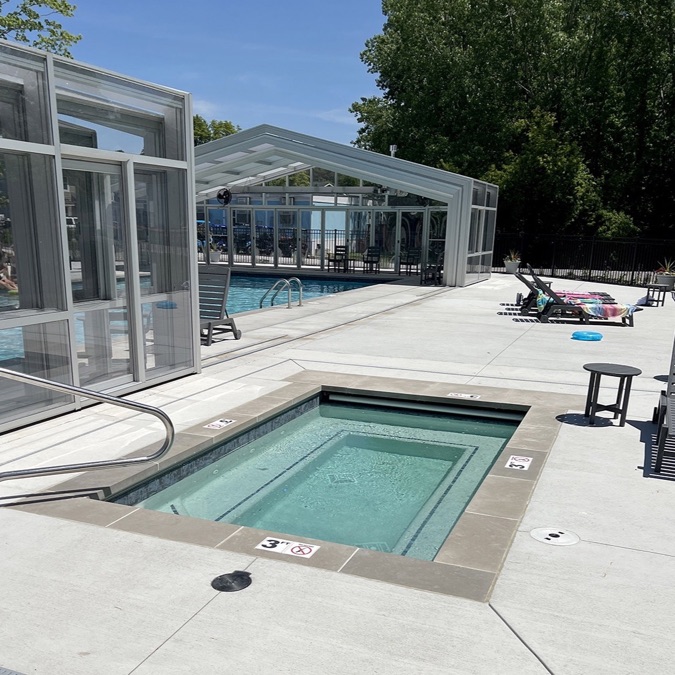 Community hot tub beside the pool