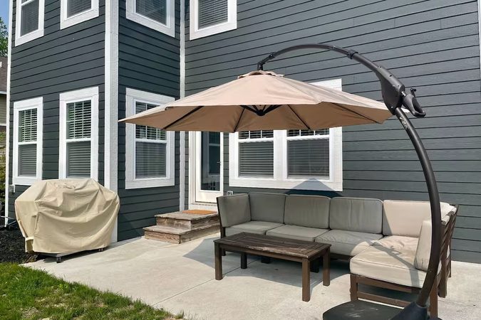 Patio sectional, umbrella and BBQ grill