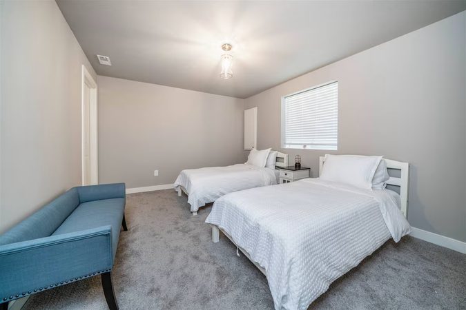Lower-level bedroom with two twin beds