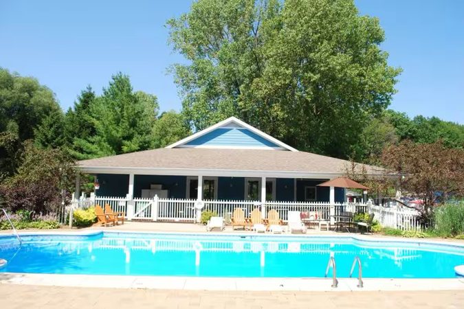Outdoor community pool and clubhouse by the marina