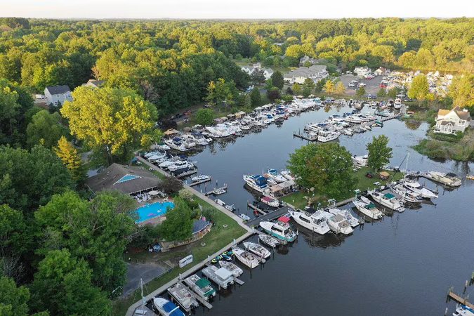 Aerial view of the marina, with the pool beside the docks