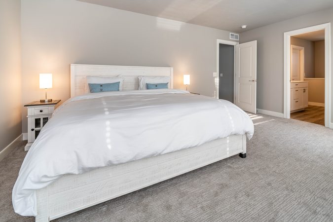Primary bedroom with a king bed and en suite bath